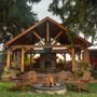 Wood Staining: Wooden patio with Muskoka Chairs around a fire pit