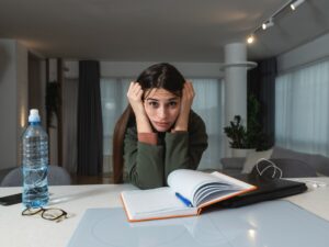 ADHD: Young freelance business finance woman has a problem with attention deficit hyperactivity disorder ADHD she cant start work on project Female lost concentration cant work from home on laptop computer