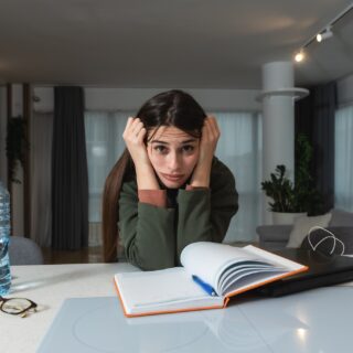 ADHD: Young freelance business finance woman has a problem with attention deficit hyperactivity disorder ADHD she cant start work on project Female lost concentration cant work from home on laptop computer