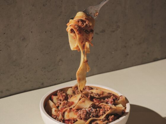 Bolognese: Pasta in a bowl with Bolognese being twirled on a fork