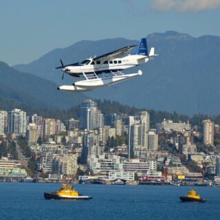 Travel Guide for Gamers: Vancouver skyline with a seaplane in the foreground