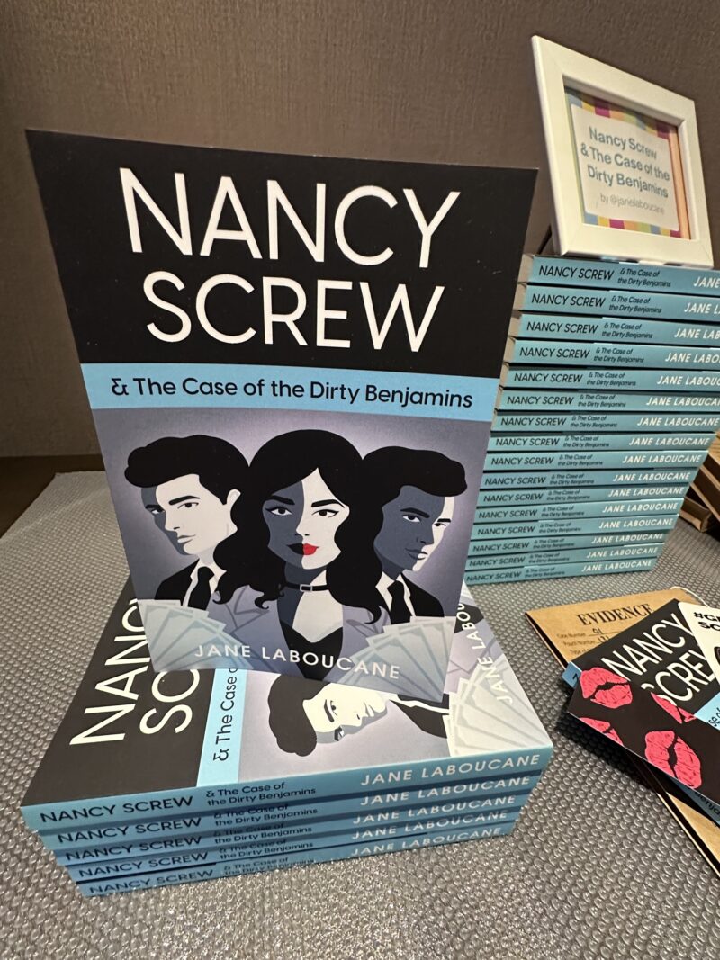 Nancy Screw & The Case of the Dirty Benjamins: Stack of books