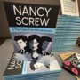 Nancy Screw & The Case of the Dirty Benjamins: Stack of books