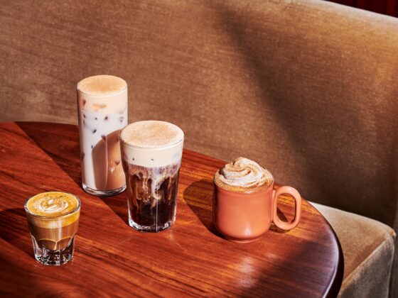 New Menu: Starbucks Pumpkin Spice Latte, Pecan Cortado, Pumpkin Spice Cold Brew and Pumpkin Spice Chai Latte in glasses on a wooden table