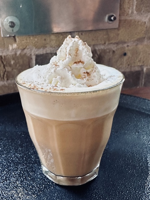 New Menu: Pumpkin Spice Latte With Whipped Cream in a glass