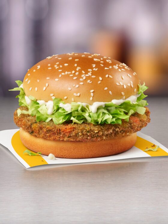 McVeggie Sandwich: Veggie Burger resting on a McDonald's paper wrapper