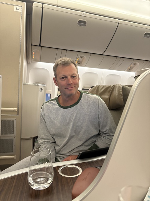 EVA Air Royal Laurel Class: Mark Zamojc in business class seat looking at camera