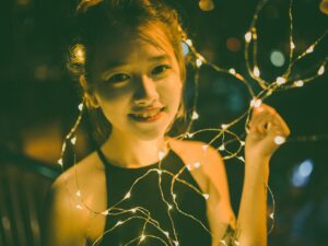 Girls' Night In: Vietnamese Young Woman surrounded by fairy lights