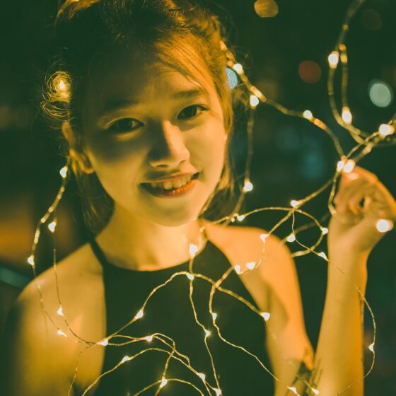 Girls' Night In: Vietnamese Young Woman surrounded by fairy lights