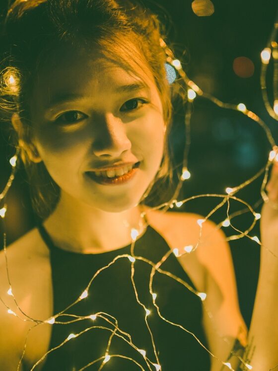 Girls' Night In: Vietnamese Young Woman surrounded by fairy lights
