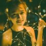 Girls' Night In: Vietnamese Young Woman surrounded by fairy lights