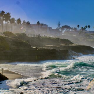 La Jolla: Beach with tide coming in over rocks