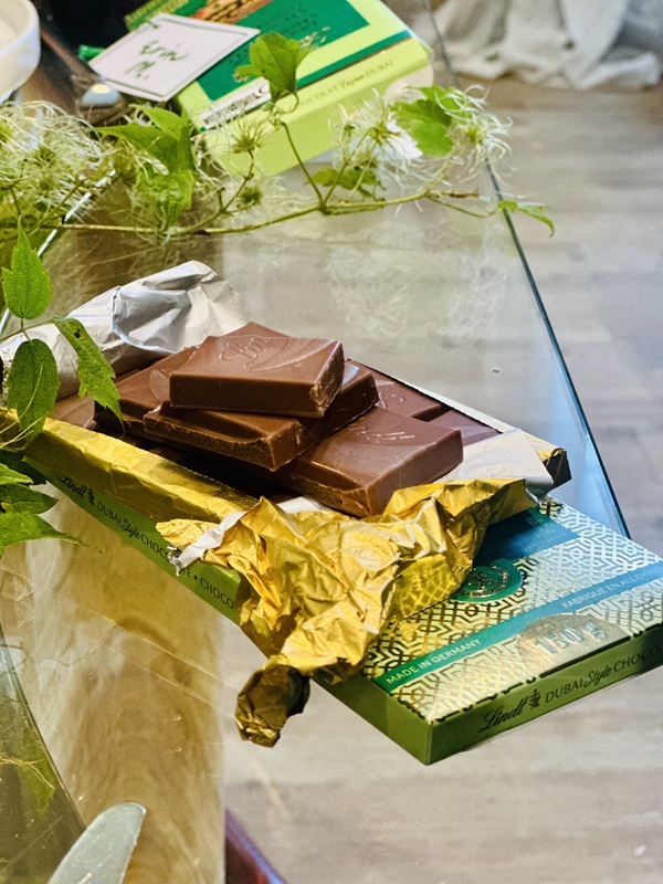 Dubai Style Chocolate Bar: Open Lindt Dubai Style Chocolate Bar opened and broken up into pieces