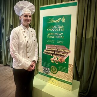 Dubai Style Chocolate Bar: Lindt's Maître Chocolatier next to a large mock up of the chocolate bar package