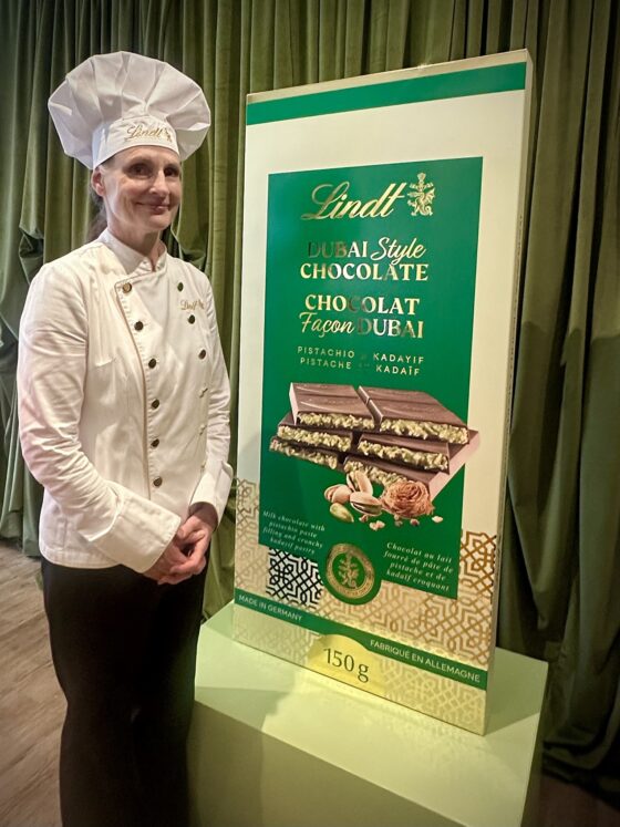 Dubai Style Chocolate Bar: Lindt's Maître Chocolatier next to a large mock up of the chocolate bar package