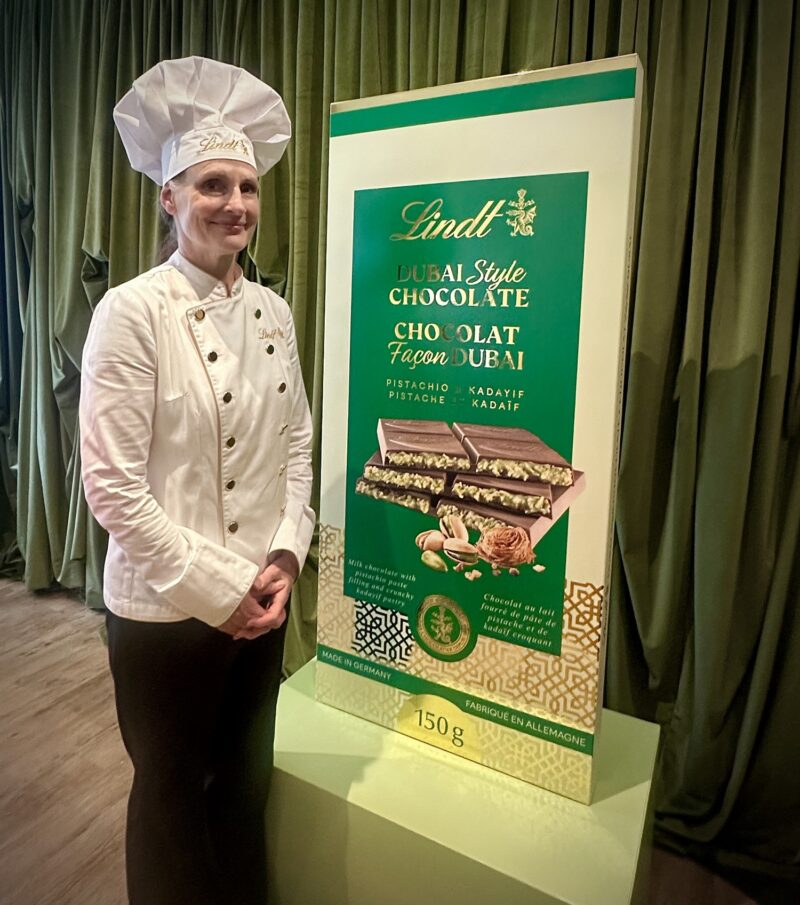 Dubai Style Chocolate Bar: Lindt's Maître Chocolatier next to a large mock up of the chocolate bar package