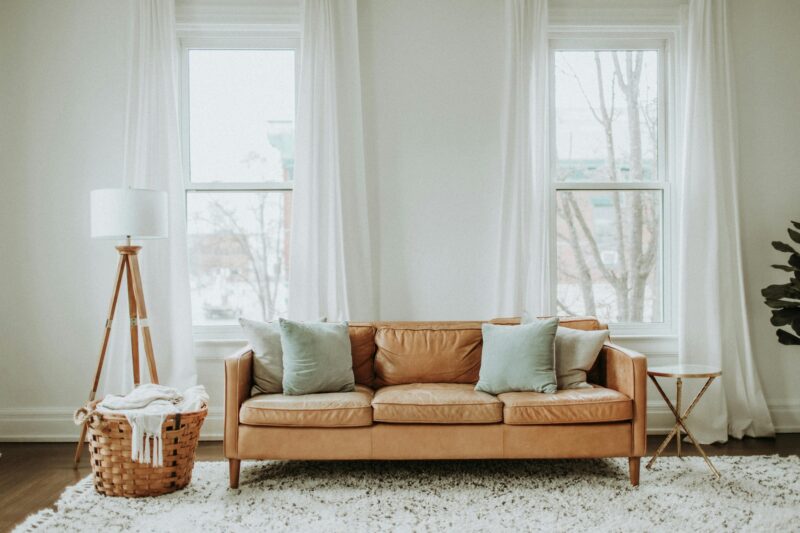 Refresh Your Living Space: Brown Sofa near window in living space