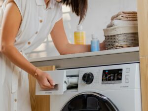 Common Washer Problems: Woman at Washing Machine