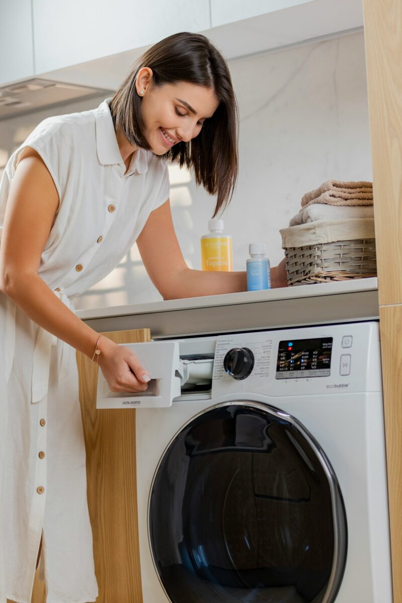 Common Washer Problems: Woman at Washing Machine