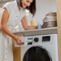 Common Washer Problems: Woman at Washing Machine
