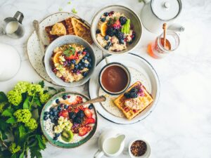 Breakfast Spread: oats, waffles, fruit parfaits laid out