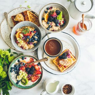 Breakfast Spread: oats, waffles, fruit parfaits laid out