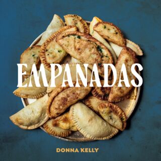 Empanadas: Cookbook cover with a pile of empanadas featured