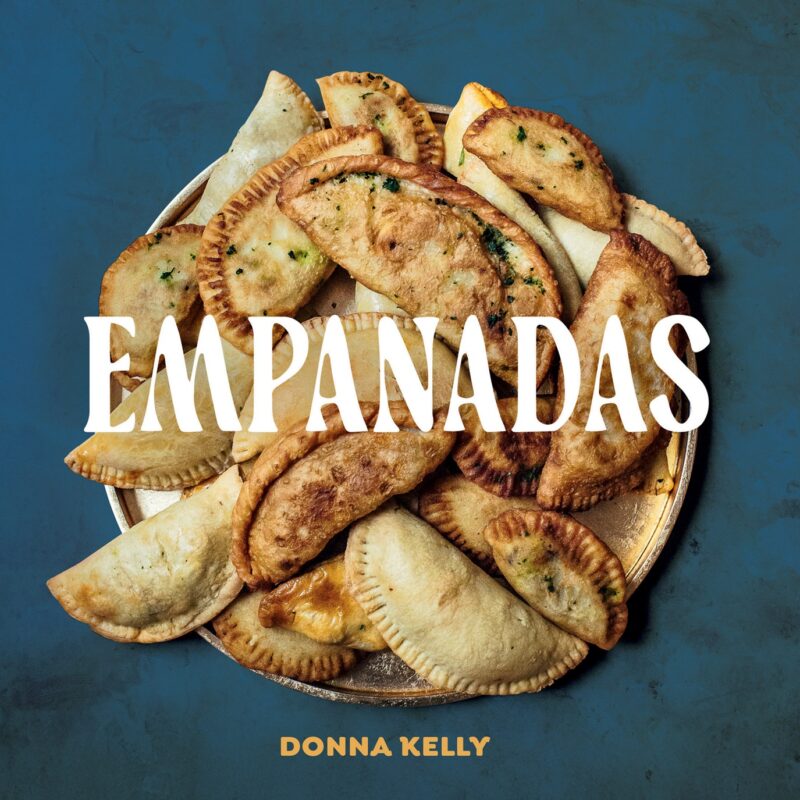 Empanadas: Cookbook cover with a pile of empanadas featured
