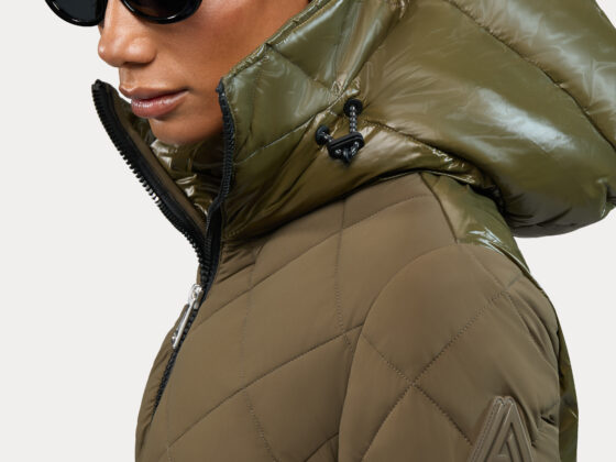 Alpenhaus: Woman in a khaki parka wearing sunglasses