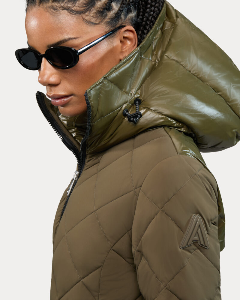 Alpenhaus: Woman in a khaki parka wearing sunglasses