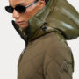 Alpenhaus: Woman in a khaki parka wearing sunglasses