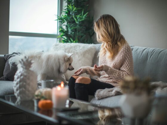 At-Home Leisure: Woman on a couch with a dog