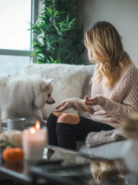 At-Home Leisure: Woman on a couch with a dog