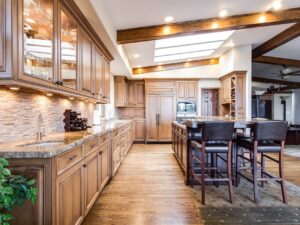 Hardwood: Large kitchen with wooden floors and cabinets