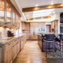 Hardwood: Large kitchen with wooden floors and cabinets