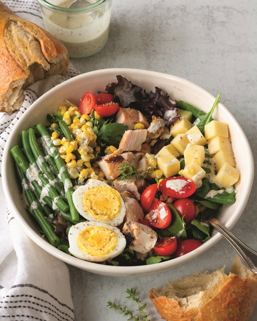 Farmhouse Weeknights: Harvest Salad with hardboiled eggs, asparagus and other vegetables in a white bowl