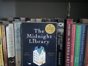 The Midnight Library: Book on a shelf with other books