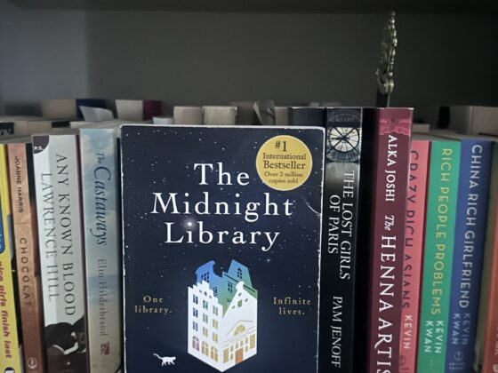 The Midnight Library: Book on a shelf with other books