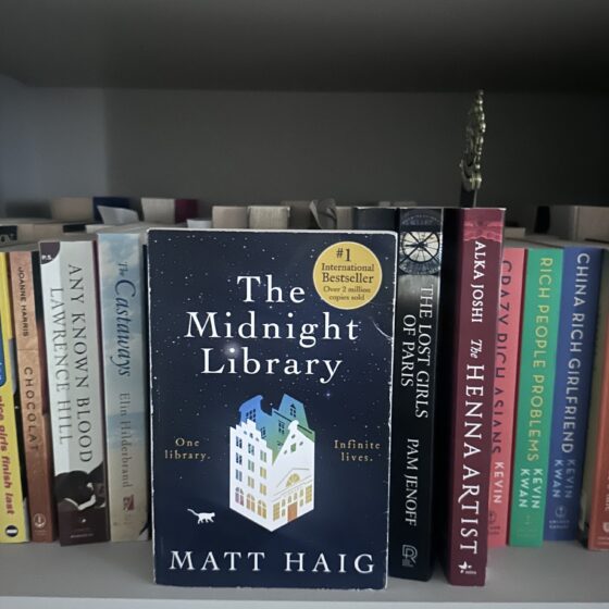 The Midnight Library: Book on a shelf with other books
