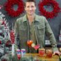 Holiday Ritual: Actor Andrew Walker behind a bar that is decorated with holiday decor with Ocean Spray Cans and cocktails in front of him