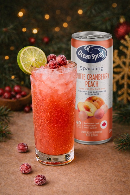 Holiday Ritual: Can of Ocean Spray Sparkling White Peach and Cranberry drink next to a cockail