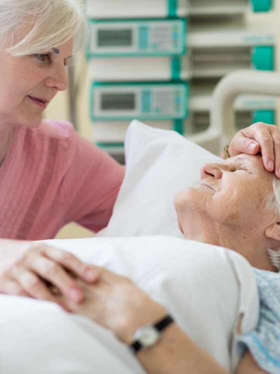 Palliative Care: Daughter visiting her senior mother in hospital