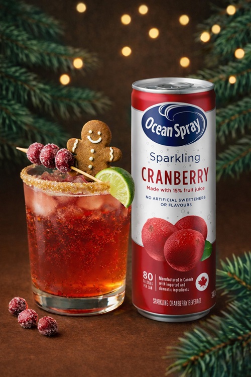 Holiday Ritual: Can of Ocean Spray Cranberry next to a cocktail with a gingerbread man garnish