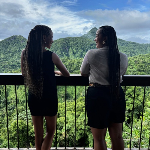 Beyond the Resort: Natalie Preddie and Kayla Williams looking out onto lush vegetation