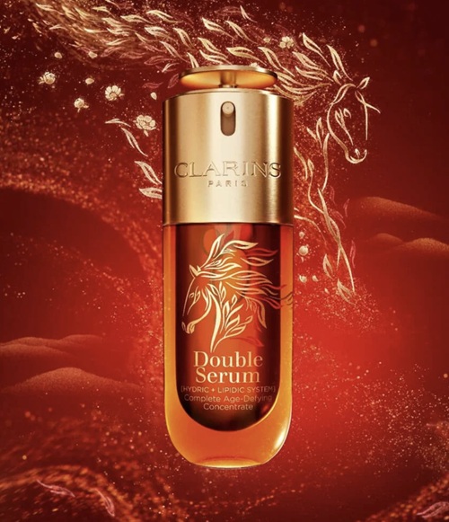 Year of the Horse: Clarins DOUBLE SERUM Lunar New Year Edition With Horse Graphic on a red and gold backyard