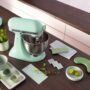 KitchenAid’s 2026 Colour of the Year: Stand mixer surrounded by kitchen accessories