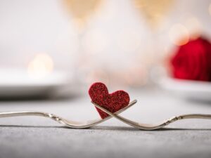 Galentine or Valentine: Forks and a heart. Holiday menu for Valentines Day.