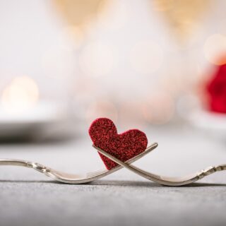 Galentine or Valentine: Forks and a heart. Holiday menu for Valentines Day.