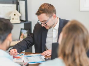 Debt Consolidation Loan: Couple speaking to a financial advisor