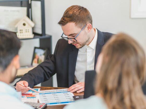 Debt Consolidation Loan: Couple speaking to a financial advisor
